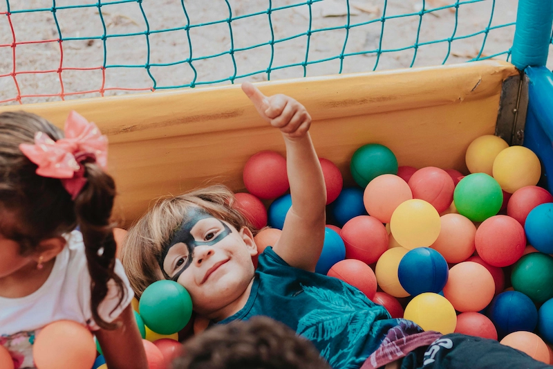 Child playing in ball pit